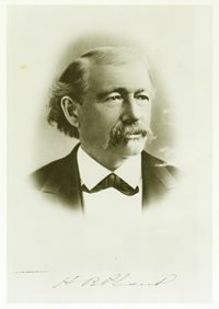 portrait of man with mustache wearing suit coat