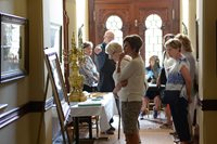 Docent Karen and guests exploring museum