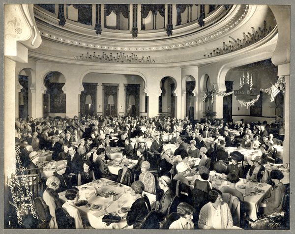 ladies and gentlemen seated in the Dining Room at TBH.