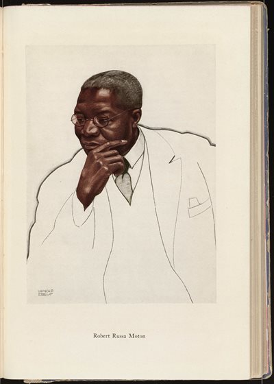 portrait of an African American man wearing glasses and suit and tie, resting his chin in his hand in a thoughtful manner