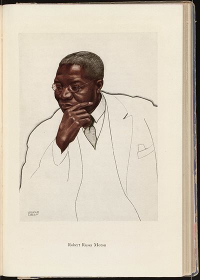 5Image-Five.jpg portrait of an African American man wearing glasses and suit and tie, resting his chin in his hand in a thoughtful manner