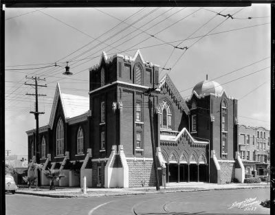 historic photo of a large church building at an intersection