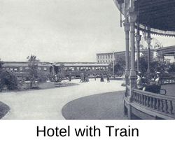 historic photo of train stopped outside Hotel