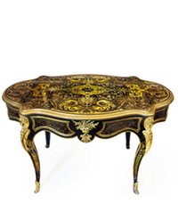 ornate table with curved legs and lots of gilding
