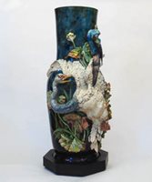 large floor vase with sculpted birds on the side