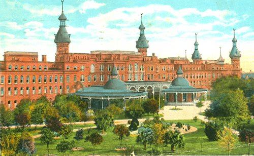 vintage postcard showing West front of Hotel. curving verandas around Grand Salon and Music Room, trees and grounds visible in foreground