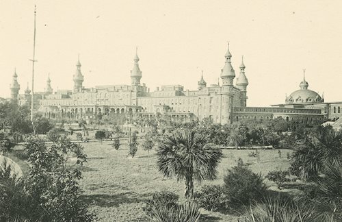 historic photo of Hotel, lush grounds and gardens in foreground
